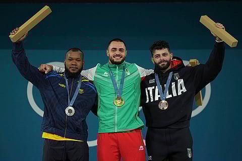 Paris Olympics men's 89kg weightlifting: Yeison Lopes of Colombia, silver, Karlos May Nasar of Bulgaria, gold, and Antonino Pizzolato of Italy, bronze
